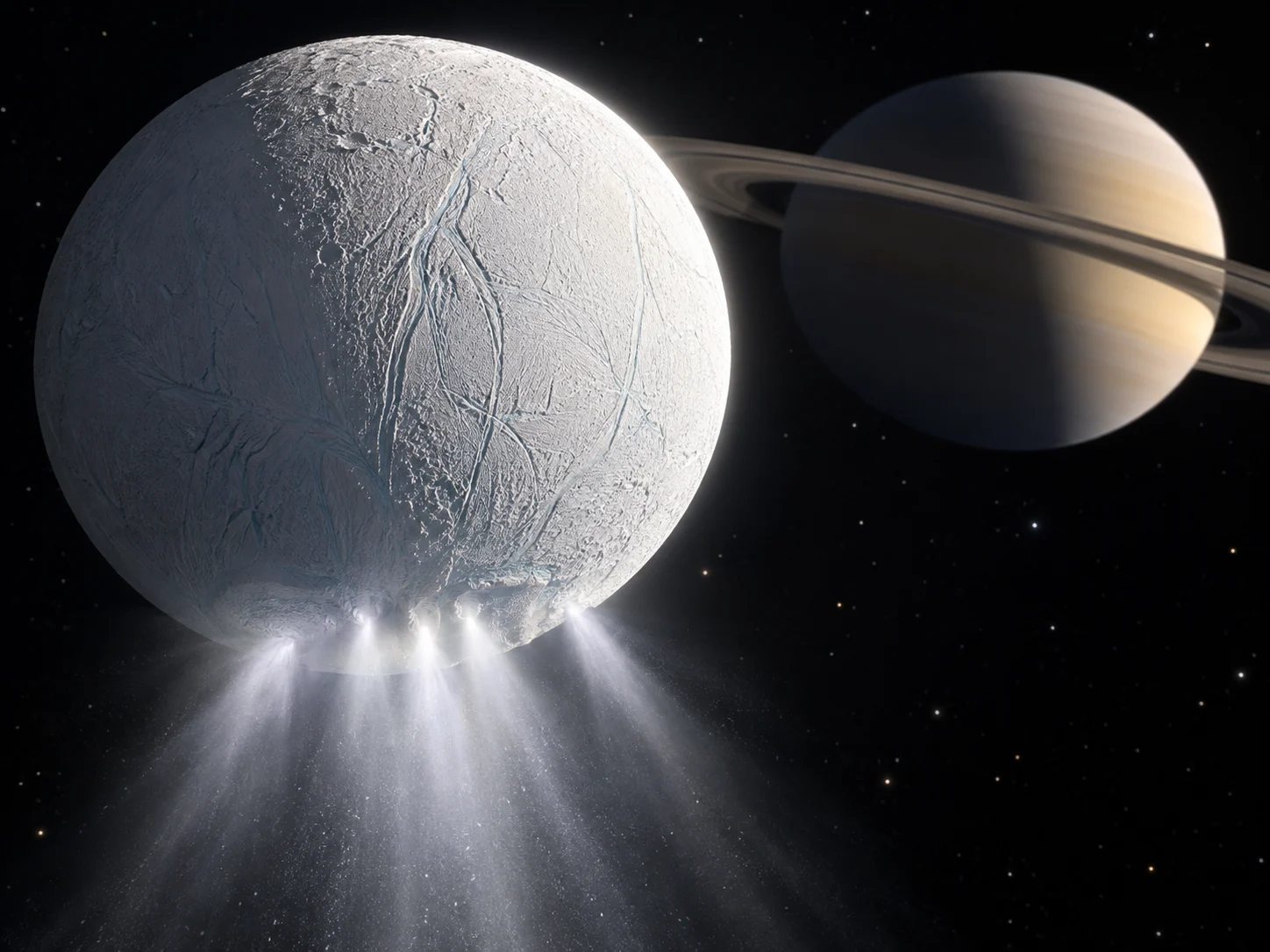 Bright plumes of water ice streaming from Enceladus with Saturn behind it
