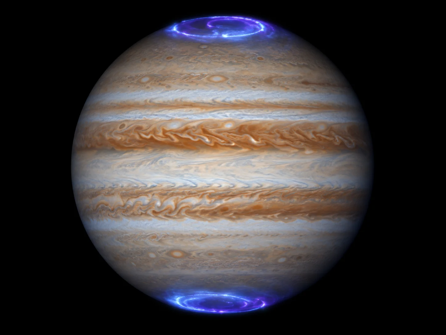 Jupiter with blue-violet auroral lights glowing above both poles
