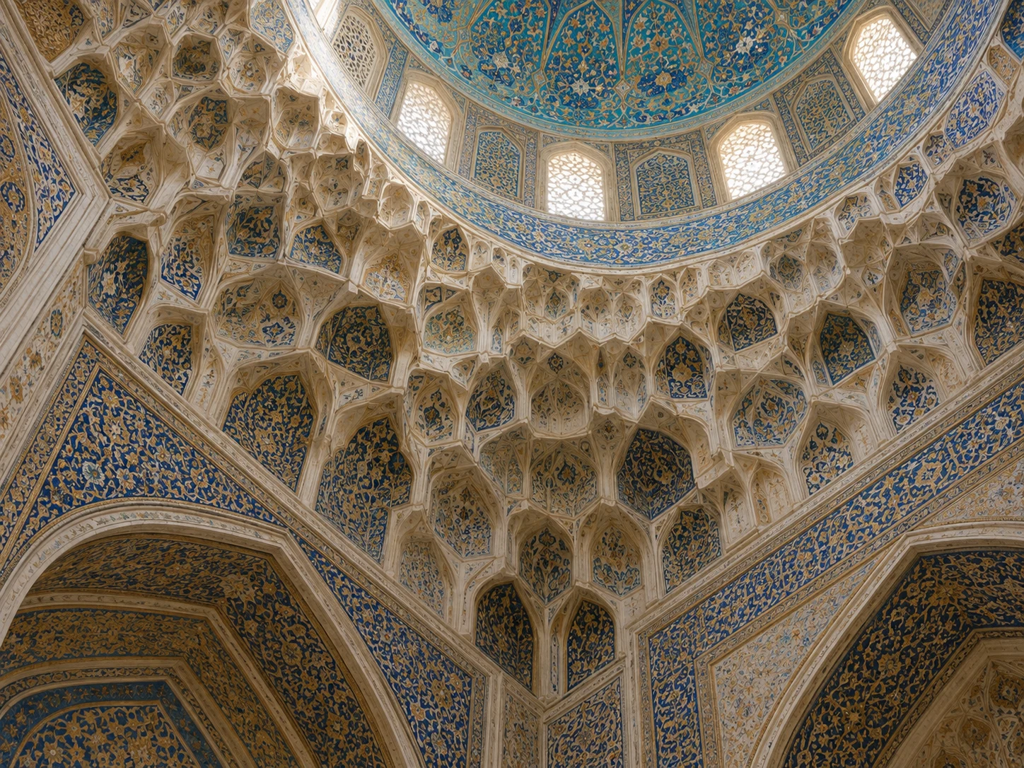 Blue and cream muqarnas niches joining square arches to a round dome